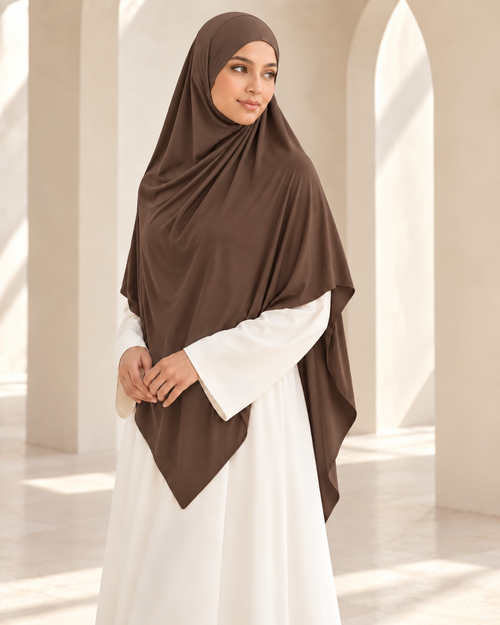 Khadijah Khimar in Brown styled with an ivory abaya